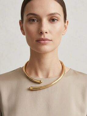 12. House of Harlow Gold Open Torque Collar Necklace